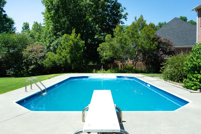 724 Avrett Cir, Evans, GA 30809 - view of swimming pool featuring view of scattered trees, a patio, and a diving board