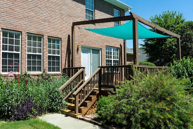 724 Avrett Cir, Evans, GA 30809 - view of exterior entry with brick siding and a deck