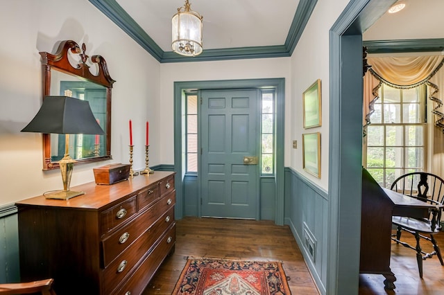 3410 Walton Way, Augusta, GA 30909 - foyer featuring ornamental molding, plenty of natural light, dark wood finished floors, a chandelier, and a wainscoted wall