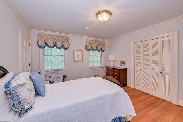 3410 Walton Way, Augusta, GA 30909 - bedroom with crown molding, light wood-type flooring, and a closet