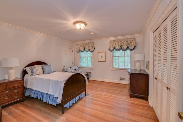 3410 Walton Way, Augusta, GA 30909 - bedroom with light wood finished floors, crown molding, and a closet