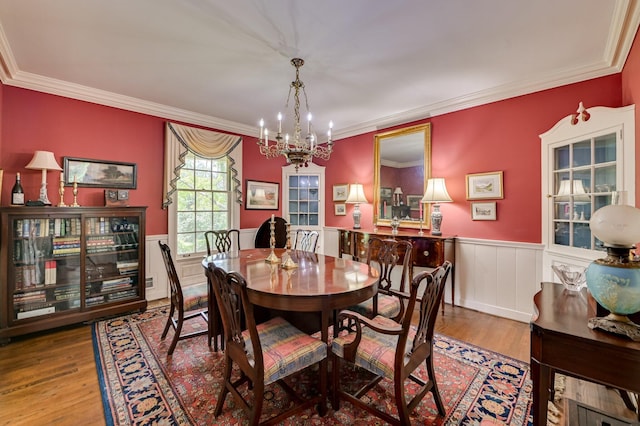 3410 Walton Way, Augusta, GA 30909 - dining room featuring a chandelier, wood finished floors, wainscoting, and crown molding