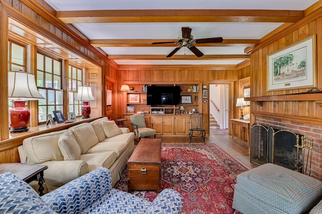 3410 Walton Way, Augusta, GA 30909 - living room with wood finished floors, beam ceiling, a brick fireplace, a ceiling fan, and wood walls