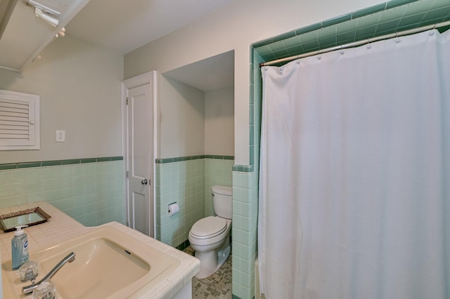 3410 Walton Way, Augusta, GA 30909 - bathroom featuring tile walls, wainscoting, a shower with curtain, and tile patterned floors