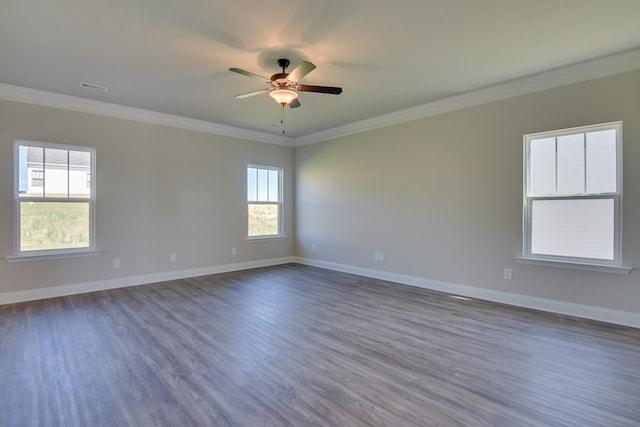 spare room with crown molding and dark hardwood / wood-style floors