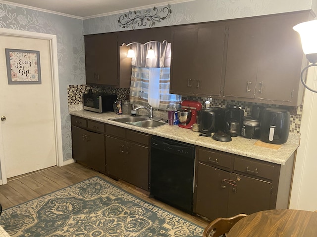 kitchen featuring dishwasher, dark brown cabinetry, sink, and light hardwood / wood-style flooring