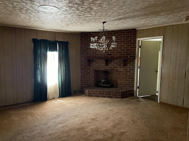 1466 Swanee Quintet Blvd, Augusta, GA 30901 - unfurnished living room with wood walls, carpet flooring, a chandelier, a textured ceiling, and a fireplace