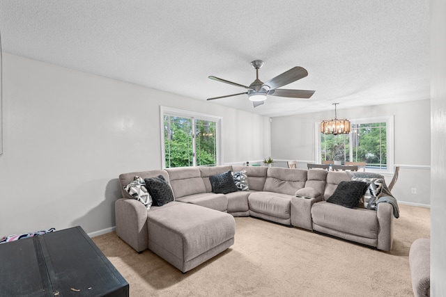 1715 Deerwood Dr, Augusta, GA 30906 - living room featuring a textured ceiling, plenty of natural light, a chandelier, and carpet floors