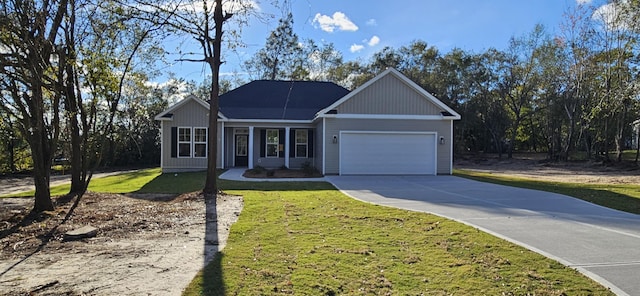 view of front of property featuring a garage and a front lawn