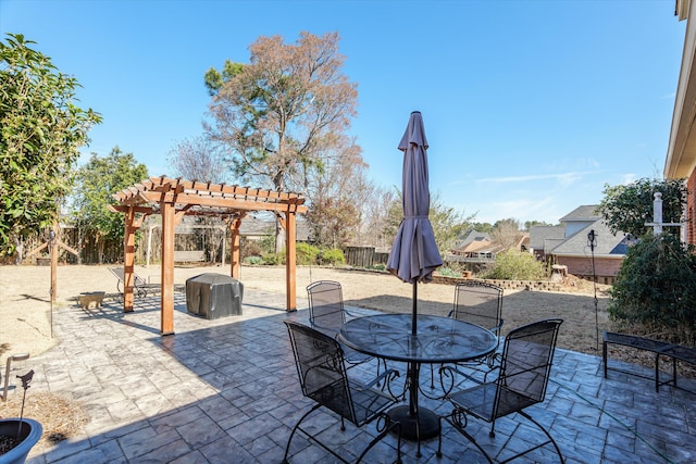 view of patio with fence, a pergola, and outdoor dining space