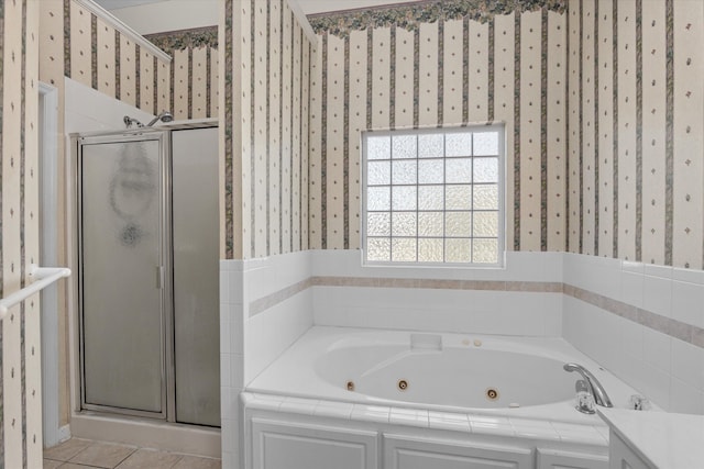 bathroom featuring a stall shower, tile patterned floors, a tub with jets, and wallpapered walls