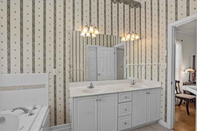 bathroom featuring a sink and wallpapered walls