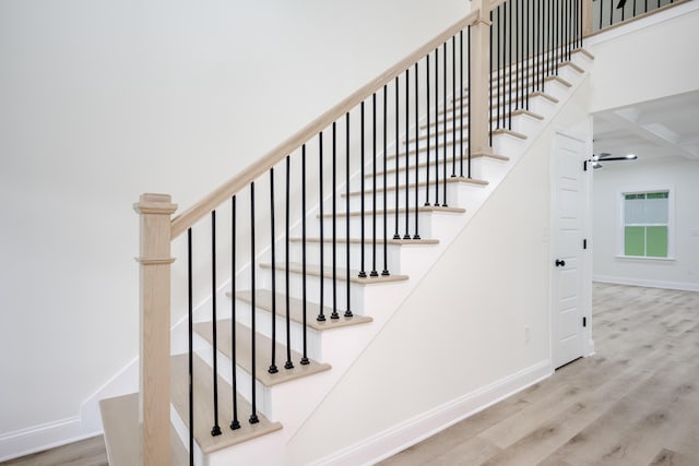 3909 Lakeside Pass, Hephzibah, GA 30815 - staircase featuring wood finished floors, baseboards, coffered ceiling, a ceiling fan, and beam ceiling