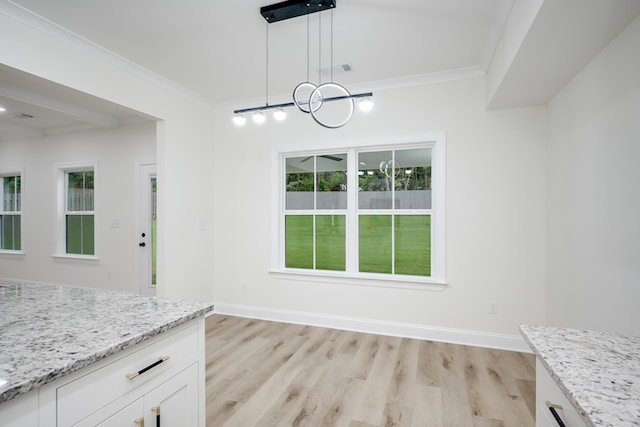3909 Lakeside Pass, Hephzibah, GA 30815 - unfurnished dining area with ornamental molding, light wood-style floors, a chandelier, and baseboards