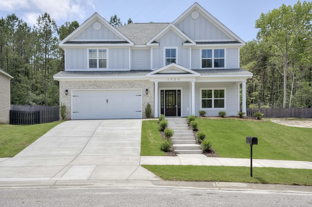 3909 Lakeside Pass, Hephzibah, GA 30815 - craftsman inspired home featuring board and batten siding, a shingled roof, driveway, a garage, and covered porch