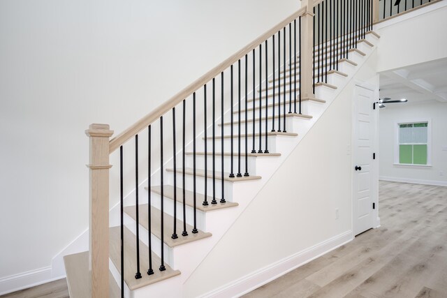3909 Lakeside Pass, Hephzibah, GA 30815 - stairs with baseboards, wood finished floors, coffered ceiling, ceiling fan, and beam ceiling