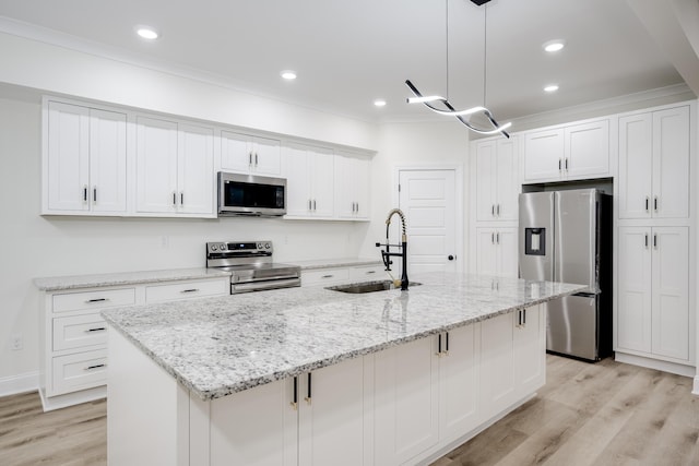 3909 Lakeside Pass, Hephzibah, GA 30815 - kitchen featuring stainless steel appliances, a sink, white cabinetry, light wood-style floors, and crown molding
