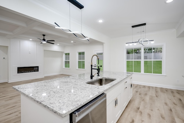 3909 Lakeside Pass, Hephzibah, GA 30815 - kitchen featuring dishwasher, a sink, light wood finished floors, a center island with sink, and white cabinets