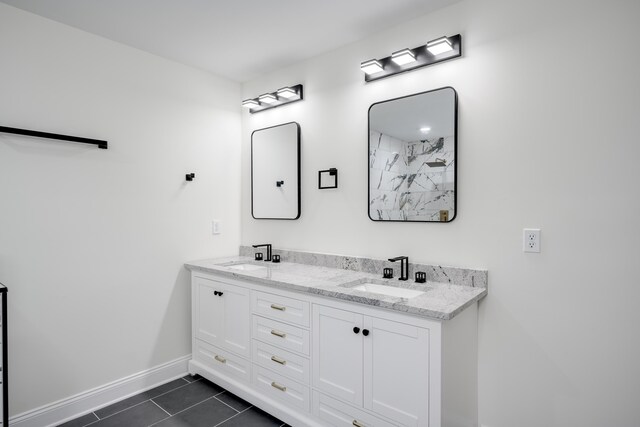 3909 Lakeside Pass, Hephzibah, GA 30815 - full bath featuring tile patterned flooring, double vanity, and baseboards