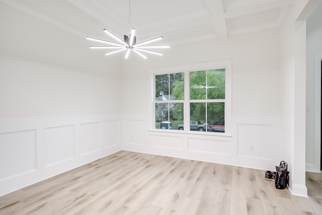 3909 Lakeside Pass, Hephzibah, GA 30815 - unfurnished room with a chandelier, beam ceiling, light wood finished floors, a wainscoted wall, and a decorative wall