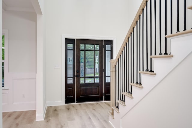 3909 Lakeside Pass, Hephzibah, GA 30815 - entryway with wood finished floors, stairway, baseboards, and a towering ceiling