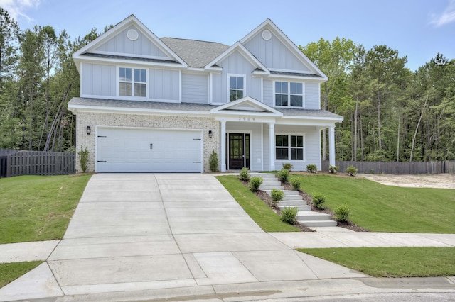 3909 Lakeside Pass, Hephzibah, GA 30815 - craftsman-style house featuring board and batten siding, concrete driveway, a garage, covered porch, and a shingled roof