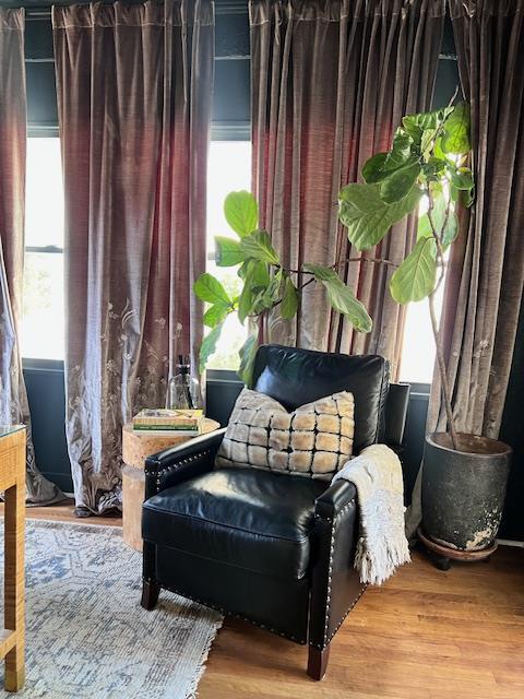 sitting room featuring plenty of natural light and wood finished floors