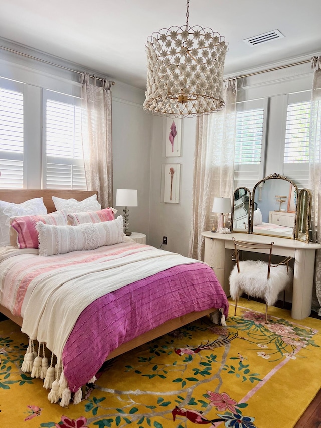 bedroom featuring visible vents