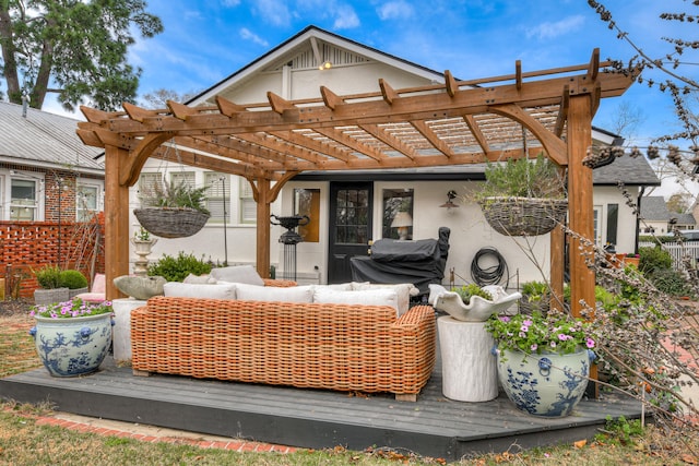 deck featuring an outdoor hangout area, a pergola, and fence