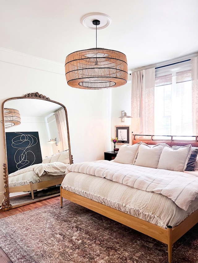 bedroom with wood finished floors