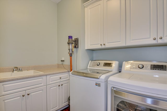 1076 Conn Dr, Evans, GA 30809 - laundry room with washing machine and clothes dryer and cabinet space