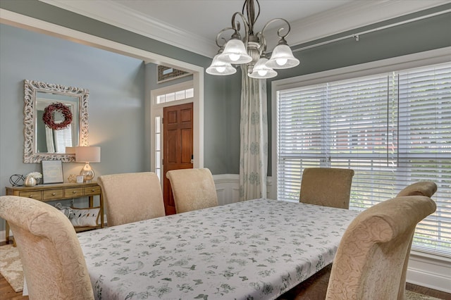1076 Conn Dr, Evans, GA 30809 - dining area featuring crown molding, a chandelier, and wood finished floors