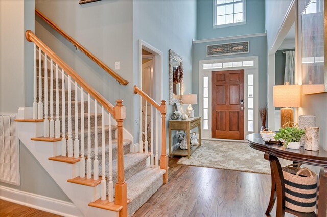 1076 Conn Dr, Evans, GA 30809 - entryway featuring a high ceiling, wood finished floors, stairs, and baseboards