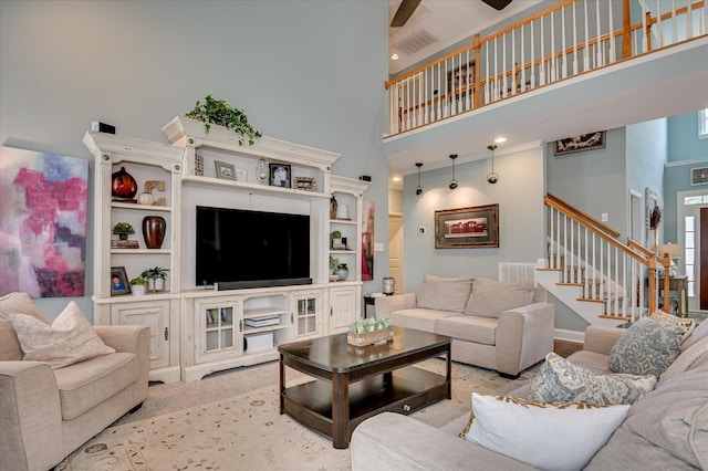 1076 Conn Dr, Evans, GA 30809 - living area with a high ceiling, stairs, and a ceiling fan
