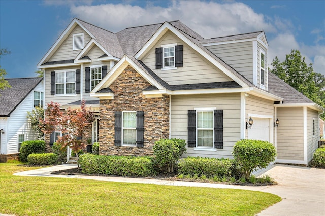 1076 Conn Dr, Evans, GA 30809 - view of front of property with roof with shingles, a front lawn, stone siding, and a garage