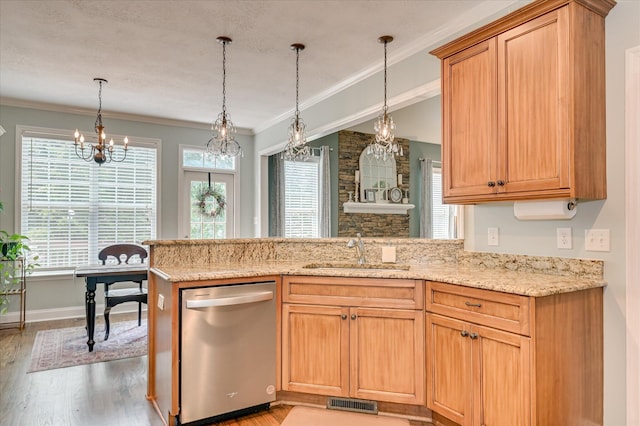 1076 Conn Dr, Evans, GA 30809 - kitchen featuring dishwasher, a sink, light wood-style flooring, a peninsula, and pendant lighting