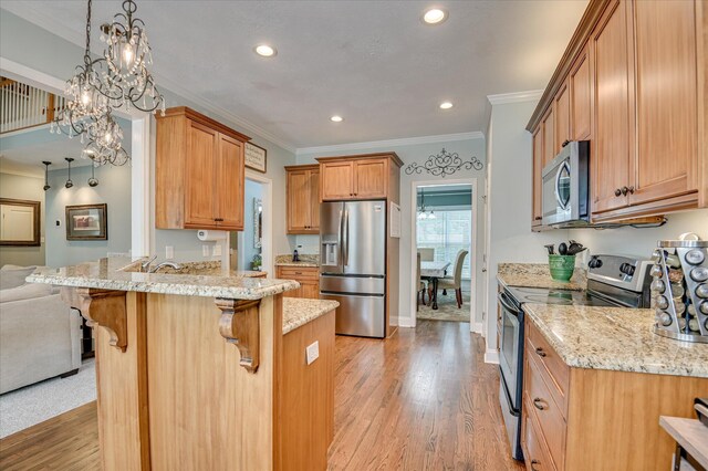 1076 Conn Dr, Evans, GA 30809 - kitchen with stainless steel appliances, a peninsula, a kitchen breakfast bar, crown molding, and light stone countertops
