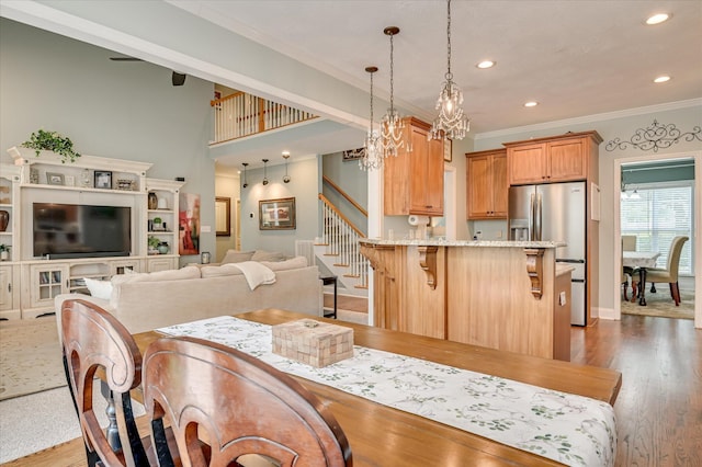 1076 Conn Dr, Evans, GA 30809 - dining space with ornamental molding, stairs, wood finished floors, recessed lighting, and a chandelier