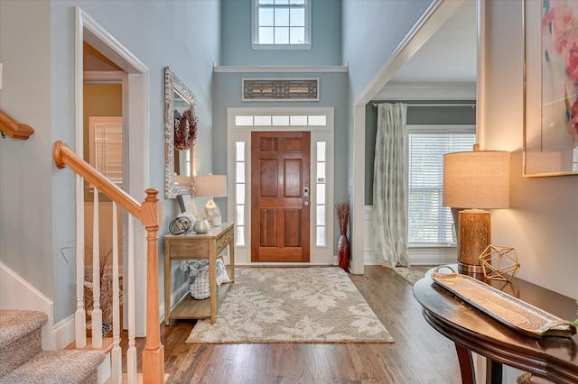 1076 Conn Dr, Evans, GA 30809 - foyer featuring stairs, wood finished floors, and a towering ceiling