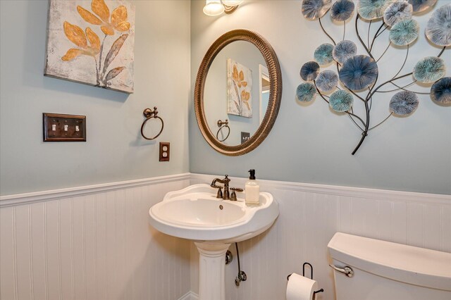1076 Conn Dr, Evans, GA 30809 - half bathroom featuring wainscoting and toilet