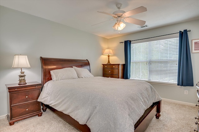 1076 Conn Dr, Evans, GA 30809 - carpeted bedroom with baseboards and a ceiling fan