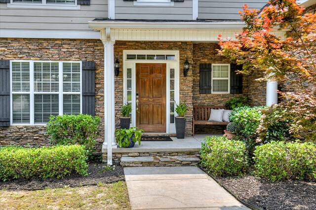 1076 Conn Dr, Evans, GA 30809 - doorway to property with covered porch and stone siding