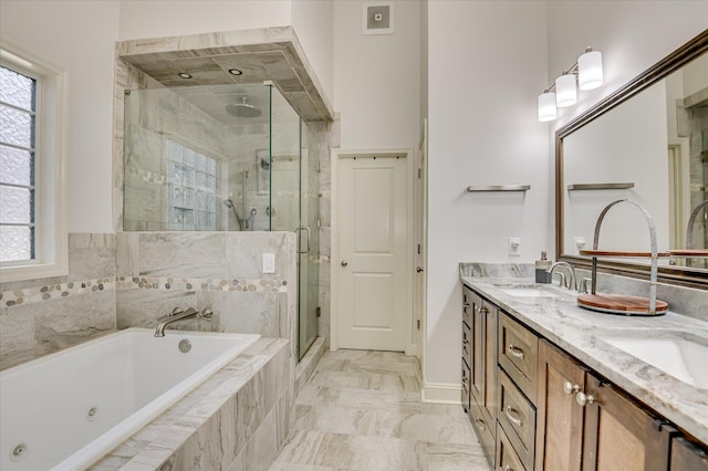 1076 Conn Dr, Evans, GA 30809 - bathroom with a tub with jets, a stall shower, double vanity, marble finish floors, and baseboards