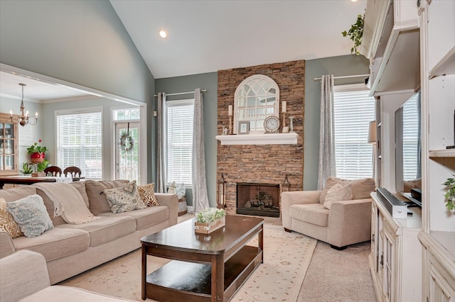 1076 Conn Dr, Evans, GA 30809 - living room featuring a chandelier, a stone fireplace, high vaulted ceiling, and recessed lighting