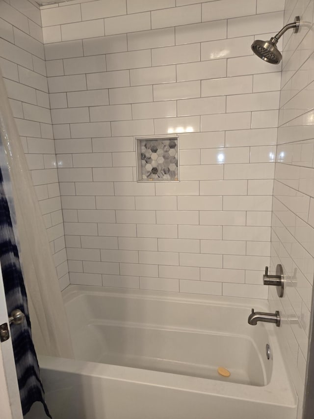 bathroom with shower / bath combo