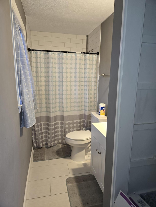 full bath featuring toilet, a shower with shower curtain, a textured ceiling, and vanity