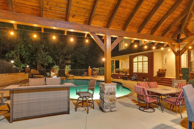 114 Nicoles Way, Grovetown, GA 30813 - pool at night with fence, outdoor dining space, a patio, and a fenced in pool