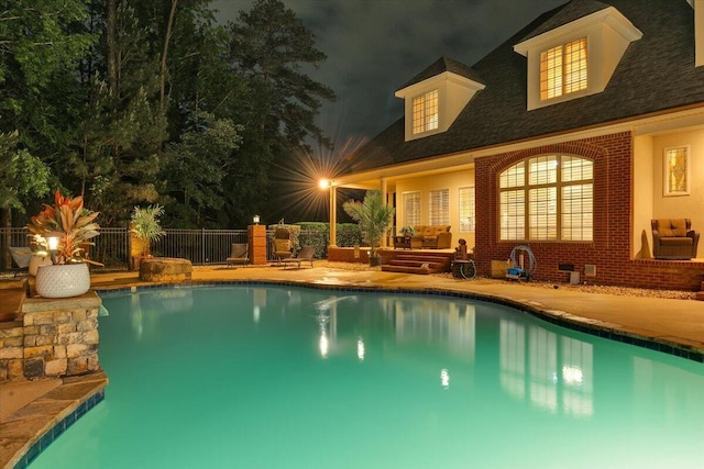 114 Nicoles Way, Grovetown, GA 30813 - pool at night featuring fence, a patio, and a fenced in pool