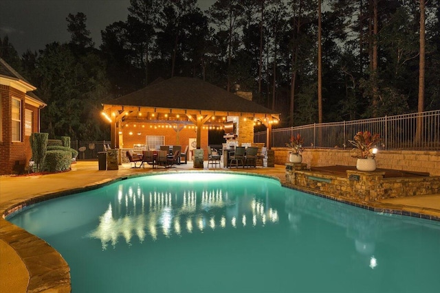 114 Nicoles Way, Grovetown, GA 30813 - pool at night featuring a patio, fence, a gazebo, and a fenced in pool