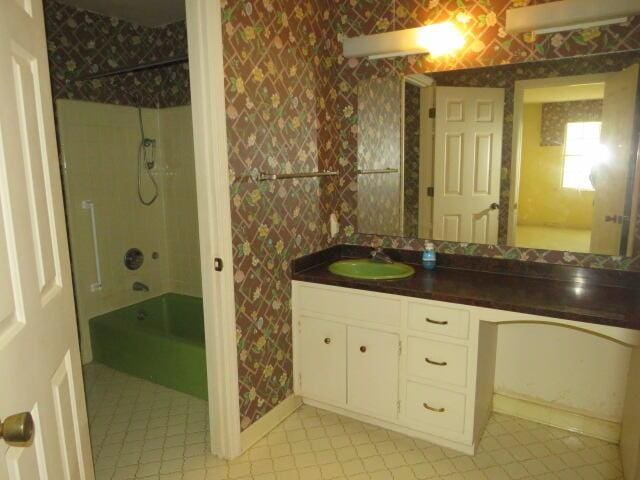 4629 Silver Lake Dr, Evans, GA 30809 - full bath with tile patterned flooring, vanity, shower / bath combination, and wallpapered walls